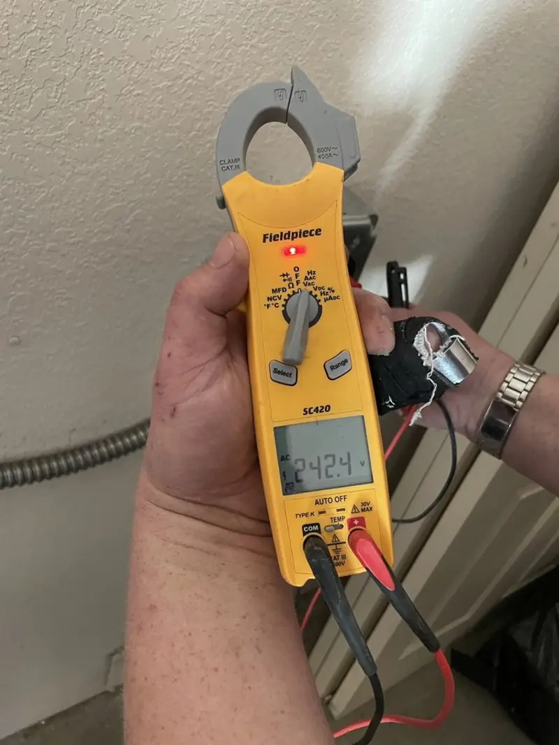 Voltage testing with clamp meter during Generator Installation in Muskegon